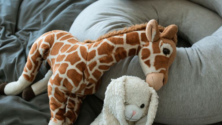 Stuffed animals on a breastfeeding pillow