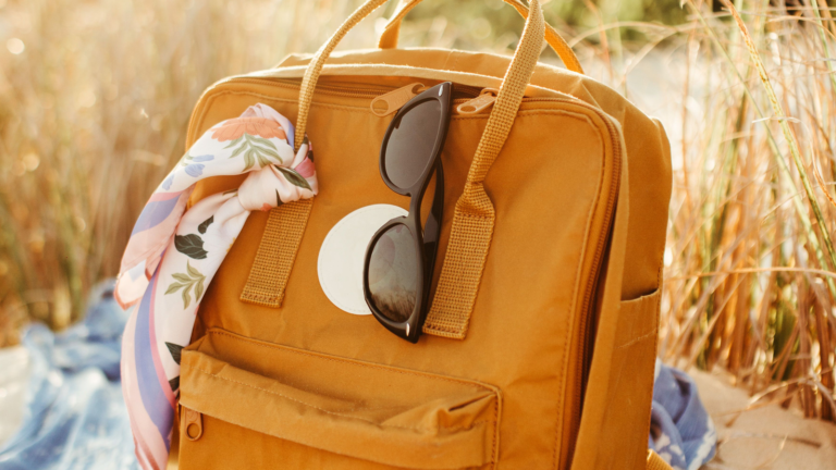 Orange backpack and sunglasses