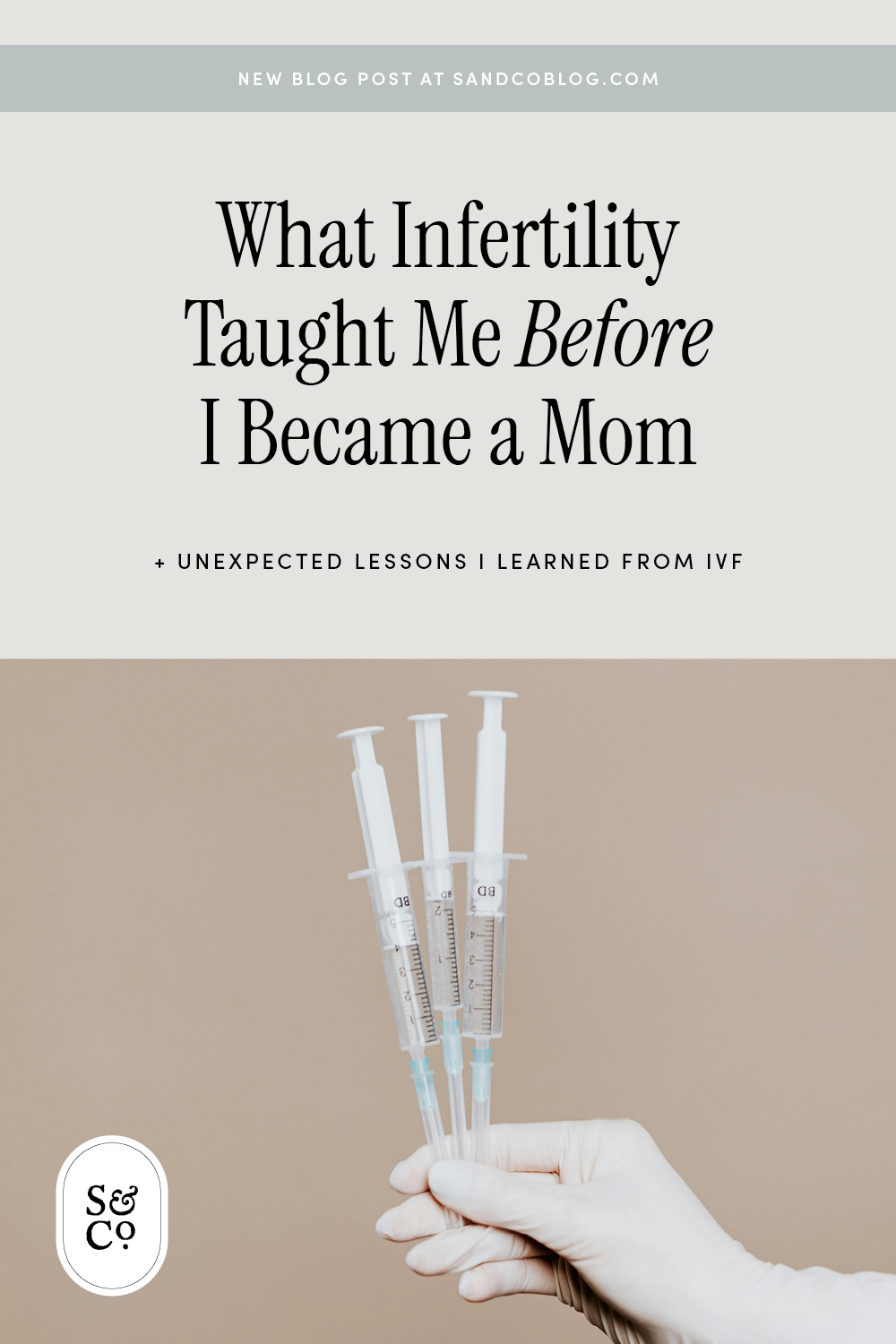 Gloved hand holding IVF needles